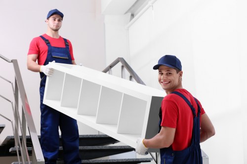 Professional movers handling furniture in Manandvan Stockwell